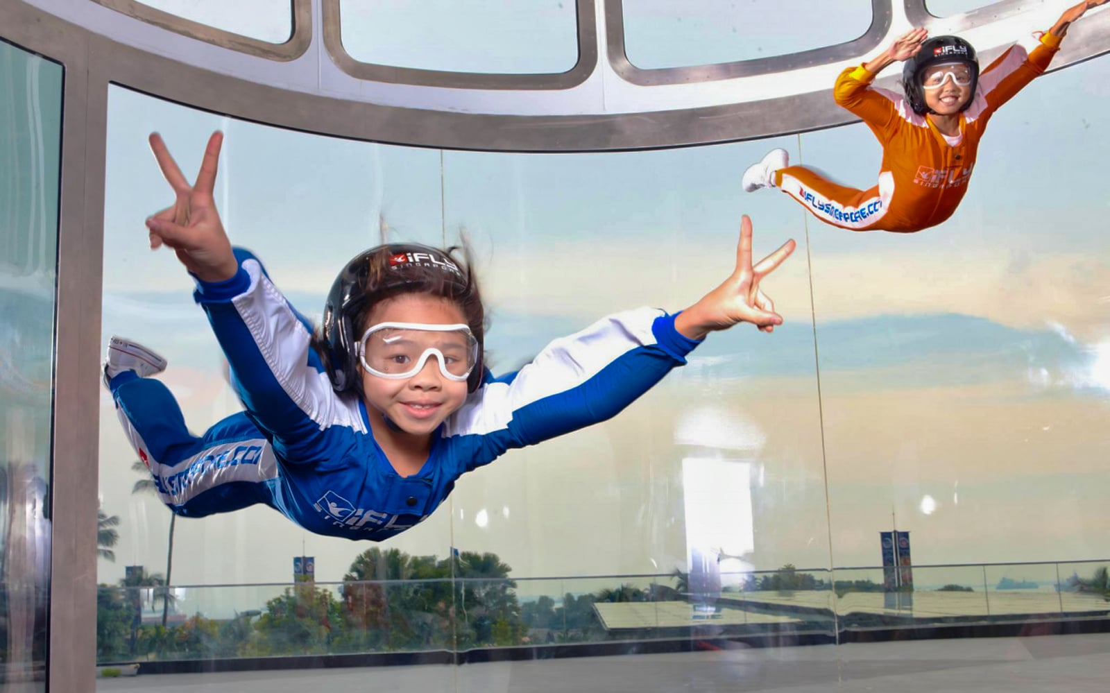 little girl flying in wind tunnel